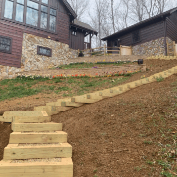 Wooden steps on sloped yard