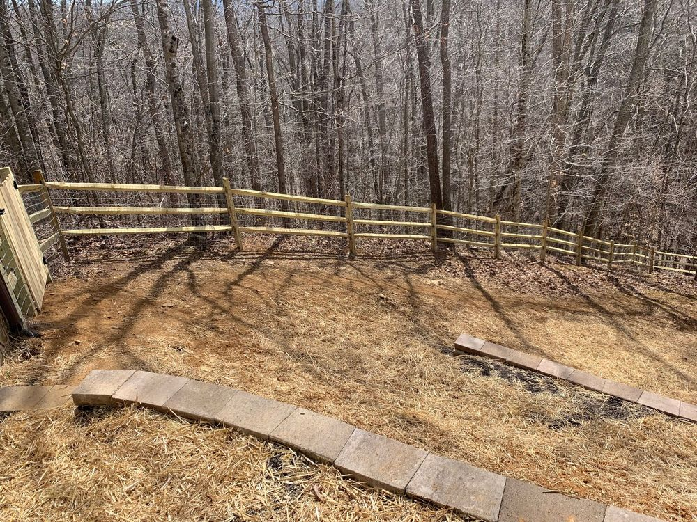 Wooden fence on forest slope