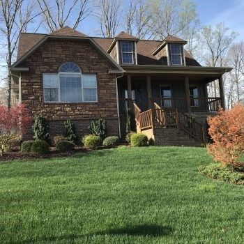Brick house with wooden porch