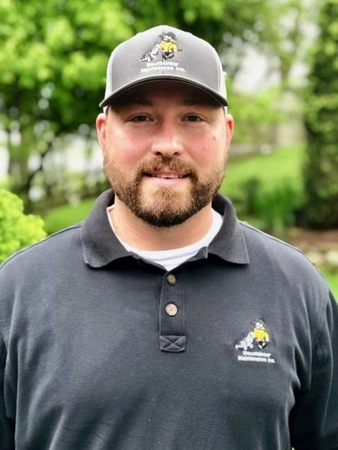 Person wearing hat standing outdoors