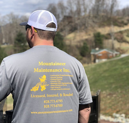 Man wearing maintenance company shirt