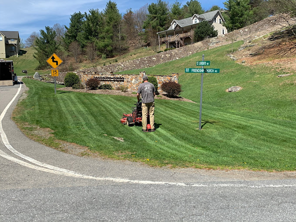 Lawn maintenance professional mowing grass