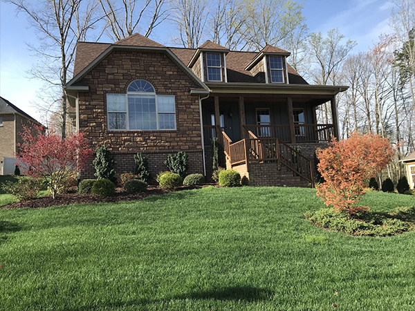 Brick house with landscaped lawn